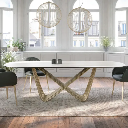 Tension table with travertine gres top by Tonin Casa.