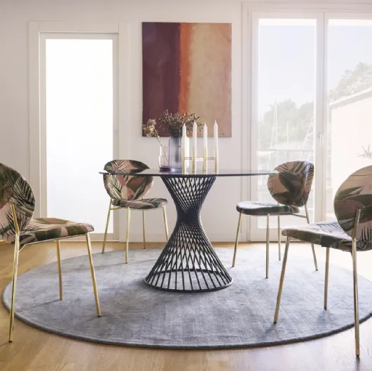 Round glass table with Vortex metal tube structure by Calligaris.