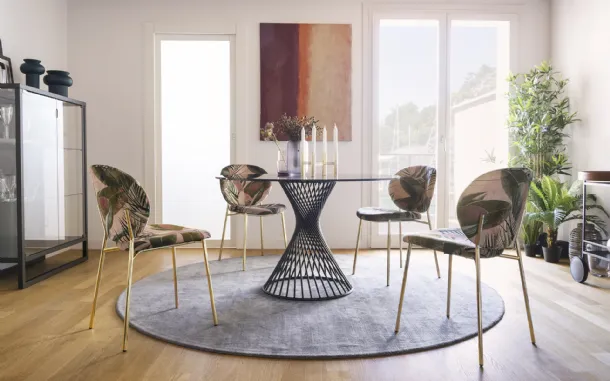 Round glass table with Vortex metal tube structure by Calligaris.