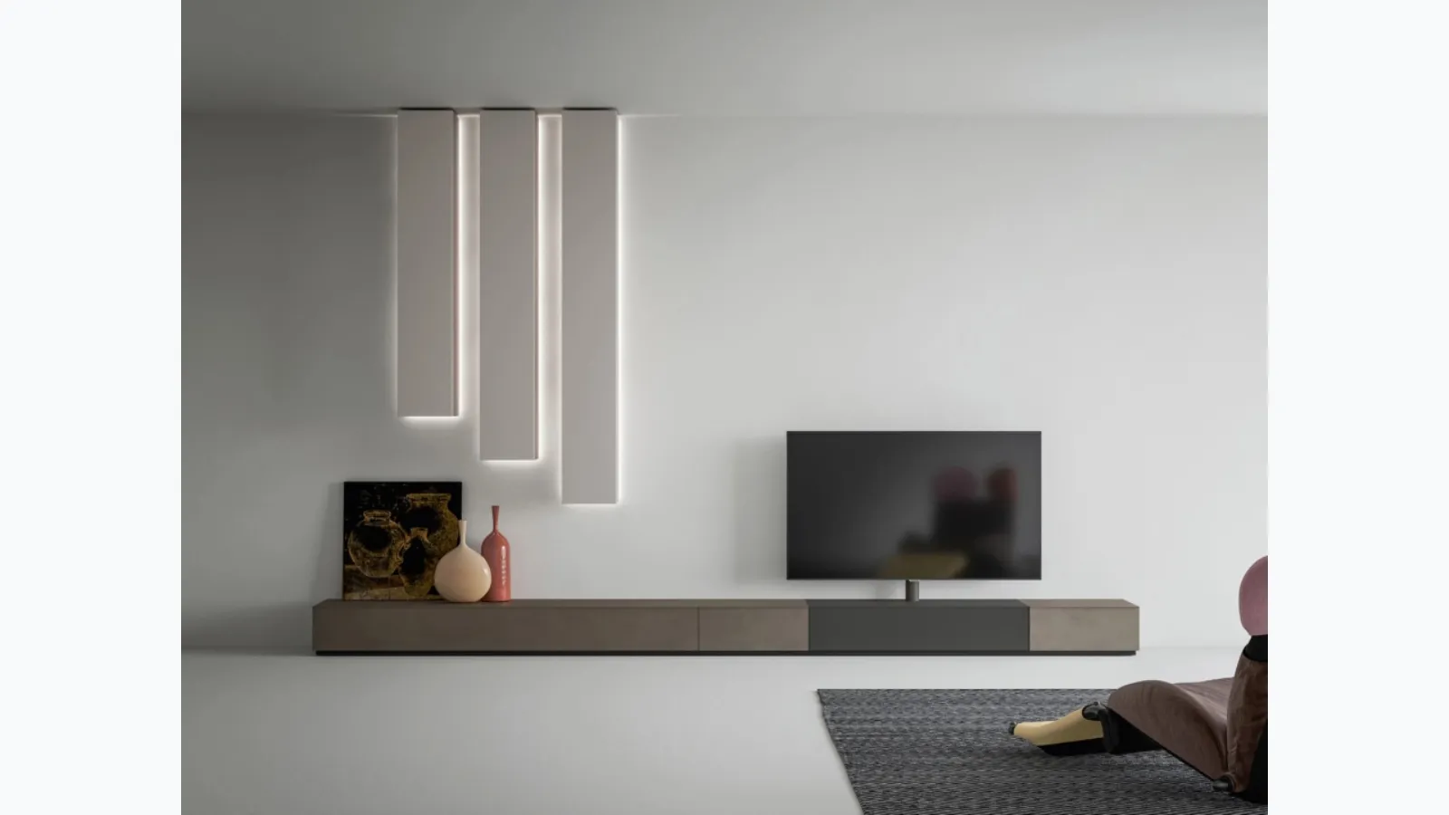 Mobile TV stand with ceiling pillars by Caccaro.