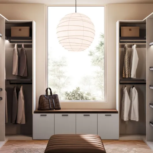 Open walk-in closet in matte lacquer and metal by Orme.