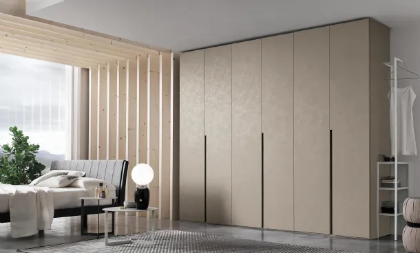 Wardrobe with swing door Doris in cement-look finish by Tomasella.