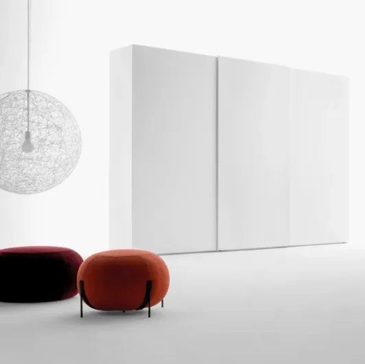 Freedhome wardrobe with sliding doors in matt white lacquered finish with an openable TV door by Caccaro.