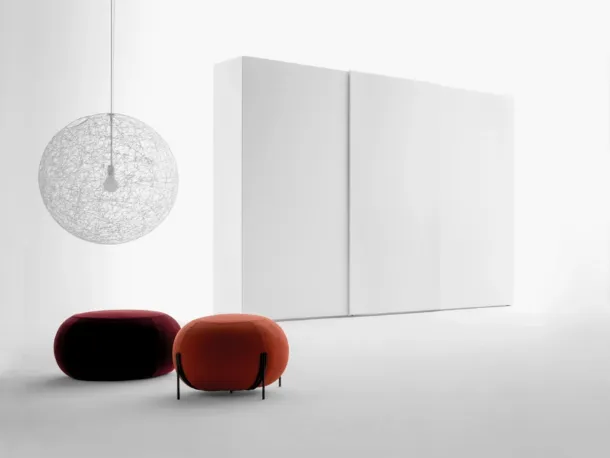 Freedhome wardrobe with sliding doors in matt white lacquered finish with an openable TV door by Caccaro.