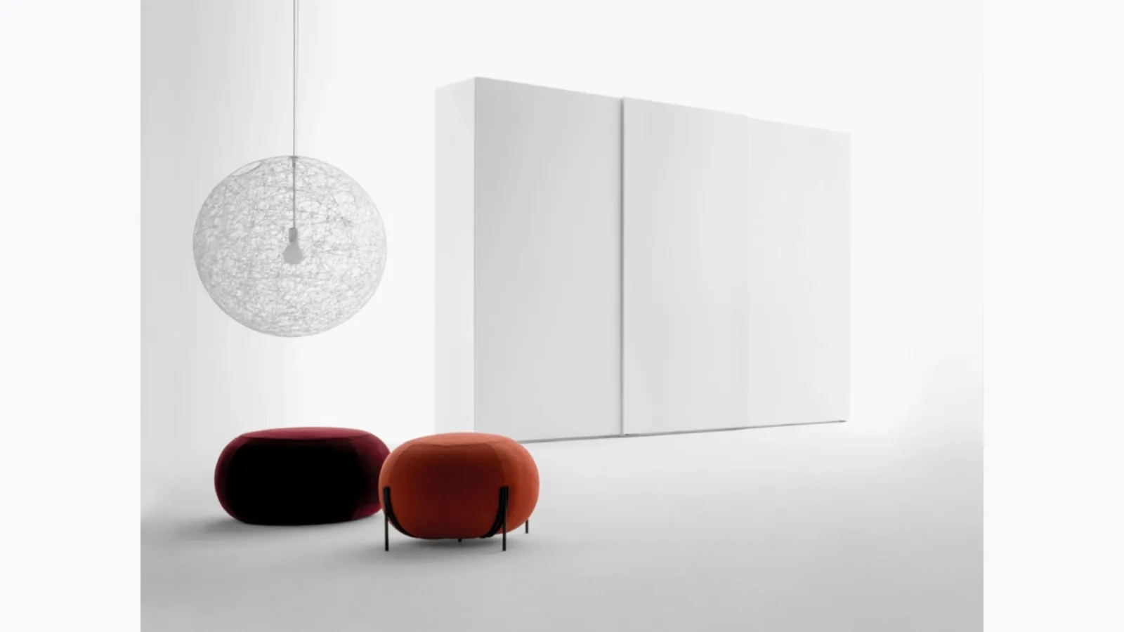 Freedhome wardrobe with sliding doors in matt white lacquered finish with an openable TV door by Caccaro.