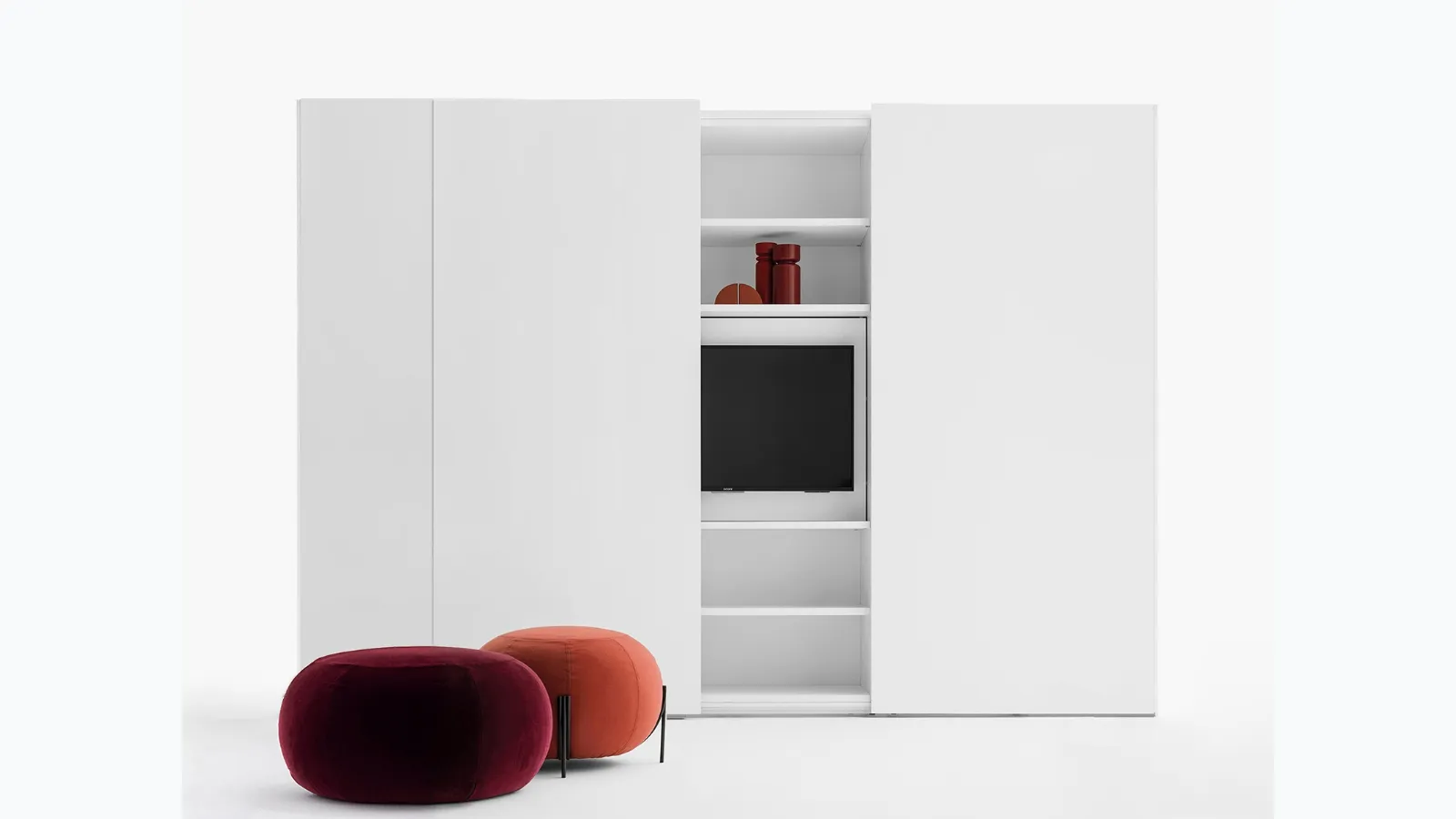 Freedhome wardrobe with sliding doors in matte white lacquer with an openable TV door by Caccaro.