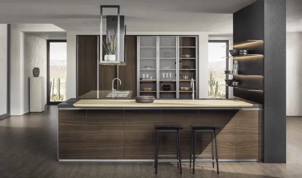 Hi-Line 6 Frame Door kitchen design with peninsula, with a Walnut base, a stainless steel and Black Lava top, and a knotty blond Oak snack counter from Molteni & C.