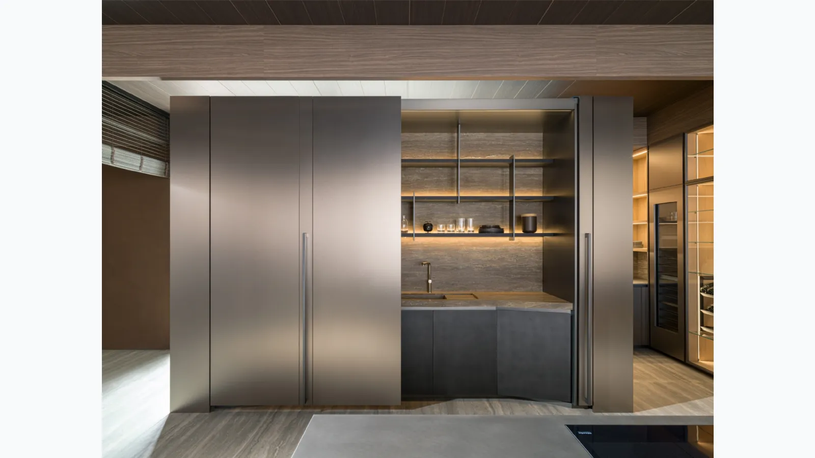 Kitchen Design Tivalì 2|0 by Yabu Pushelberg with a retractable system and sliding doors by Molteni & C