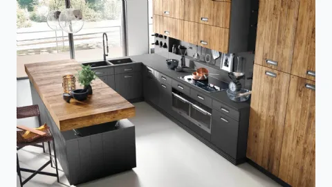 Modern kitchen with Lab 40 peninsula in lacquered and natural wood by Marchi.