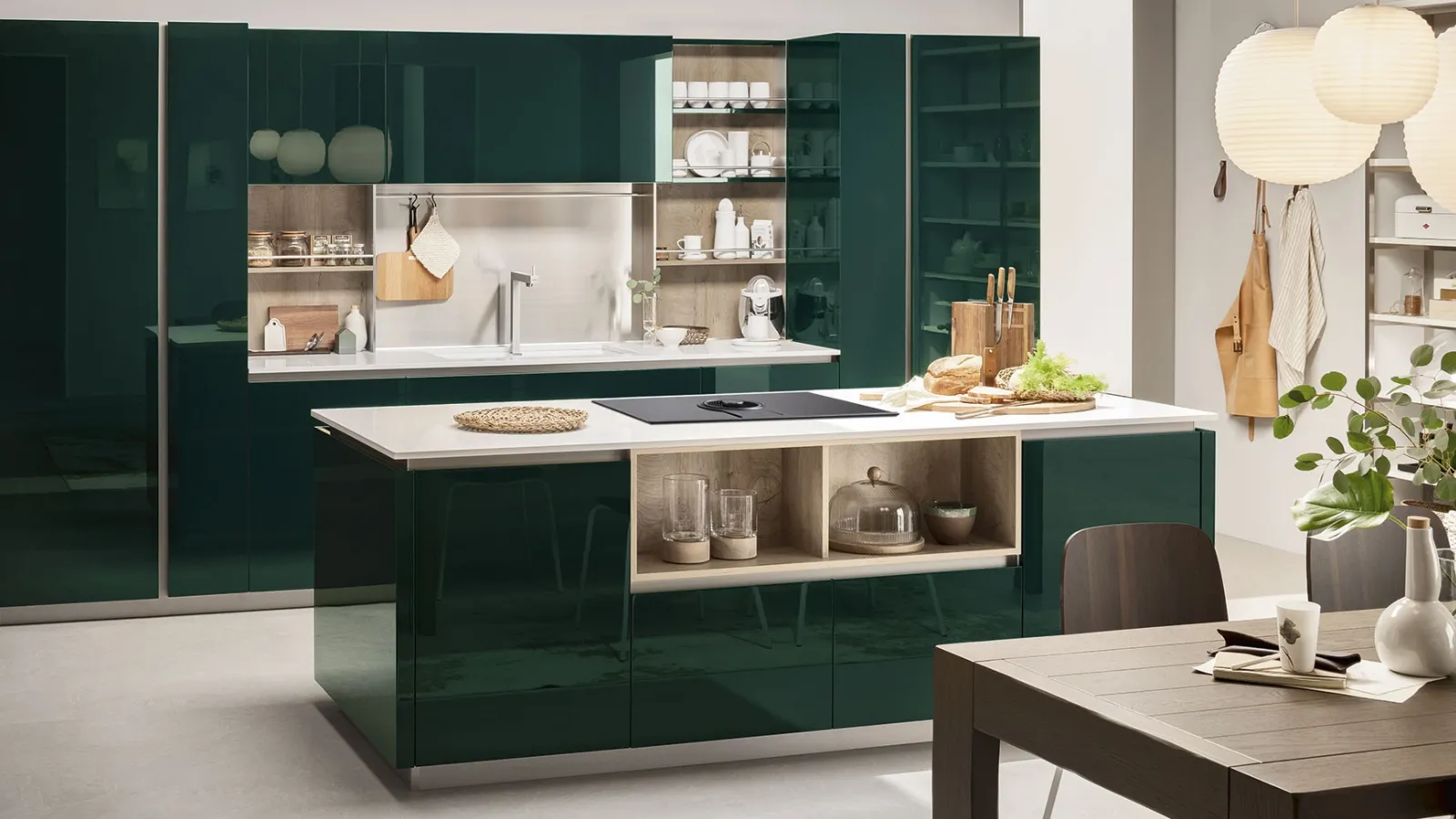 Modern kitchen with Lounge 10 island in glossy Green Alpi lacquer by Veneta Cucine.