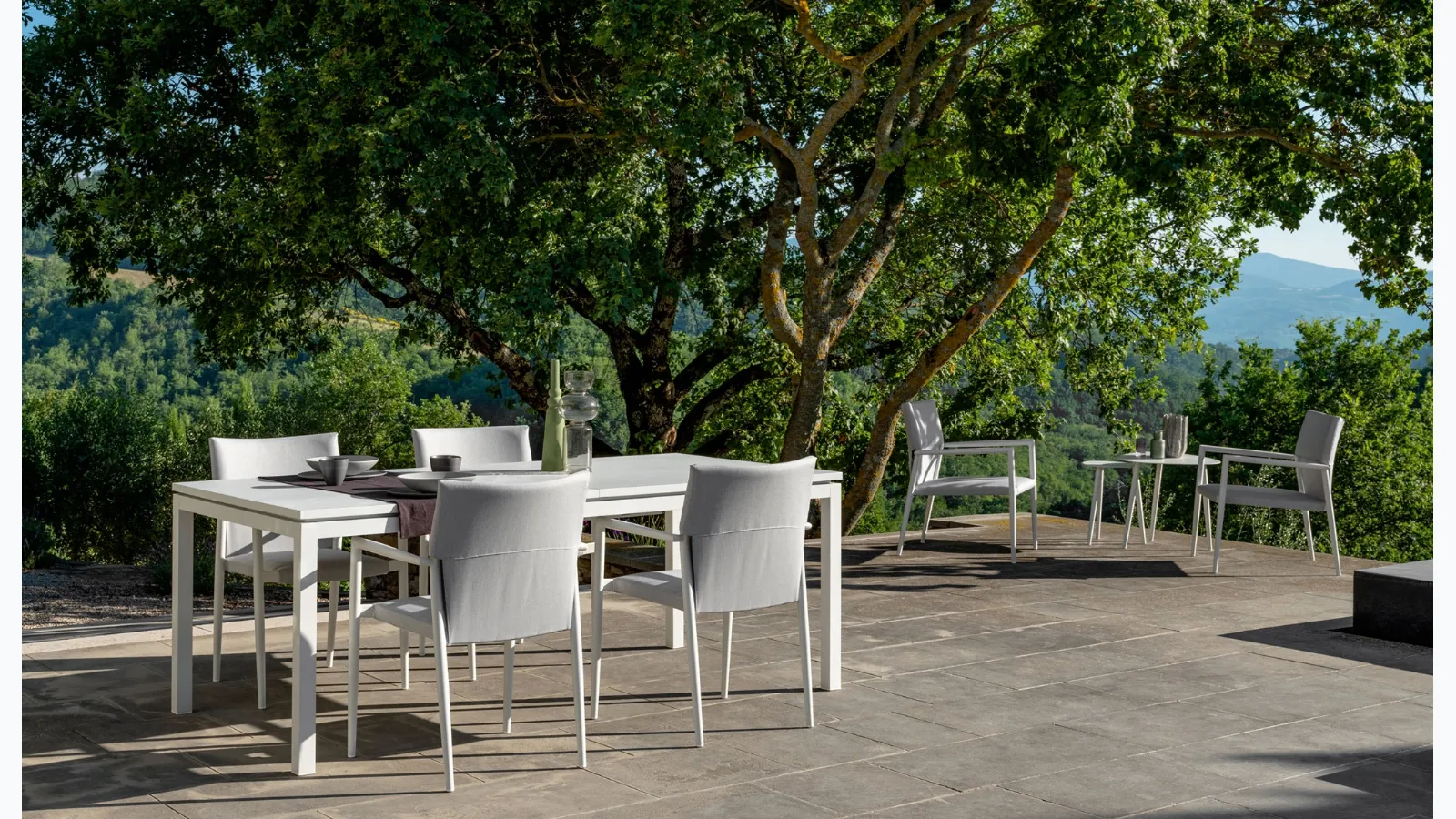 Extendable table and Adam chairs by Talenti.