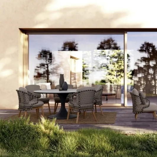 Round table with Arnold stone top by Bizzotto.