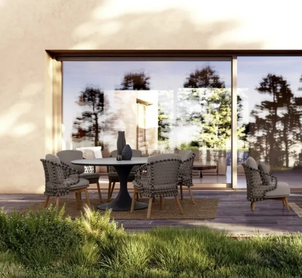 Round table with Arnold stone top by Bizzotto.