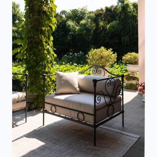 Large Aurora wrought iron armchair with padded fabric seat by Unopiu