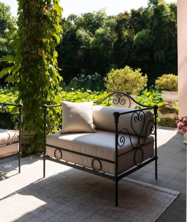 Large Aurora wrought iron armchair with padded fabric seat by Unopiu