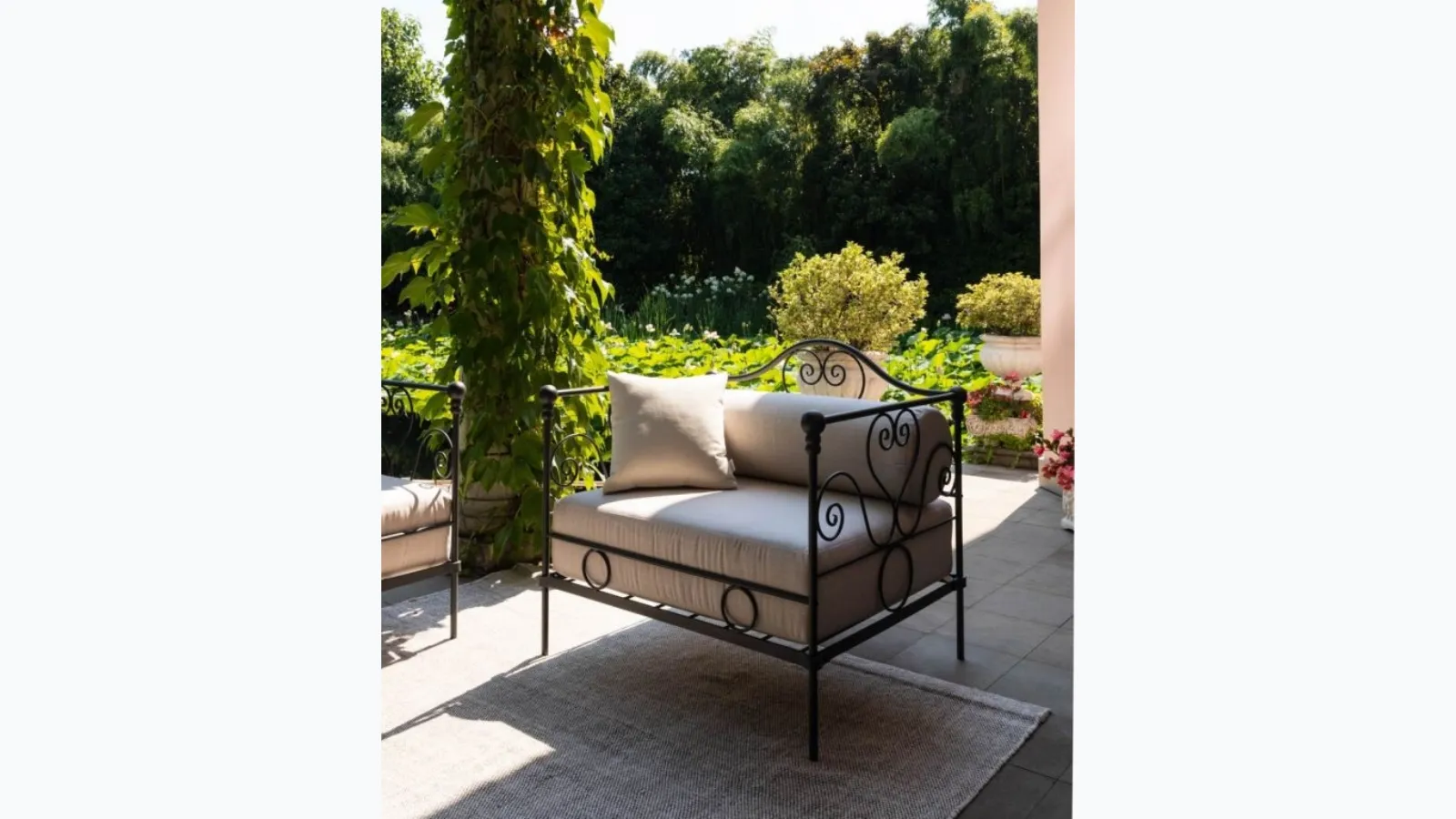 Large Aurora wrought iron armchair with padded fabric seat by Unopiu