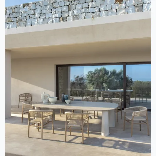 Bold stone table by Ethimo