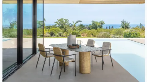 Glass table and Bond rattan chairs by Talenti.