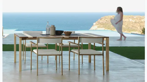 Wooden table with Casilda fabric chairs by Talenti.