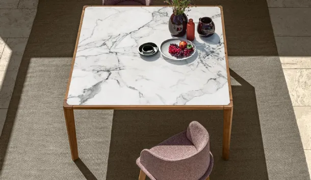 Table in stoneware and wood and chairs in fabric and wood CleoSoft Wood by Talenti.