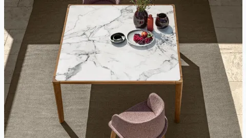 Table in stoneware and wood and chairs in fabric and wood CleoSoft Wood by Talenti.