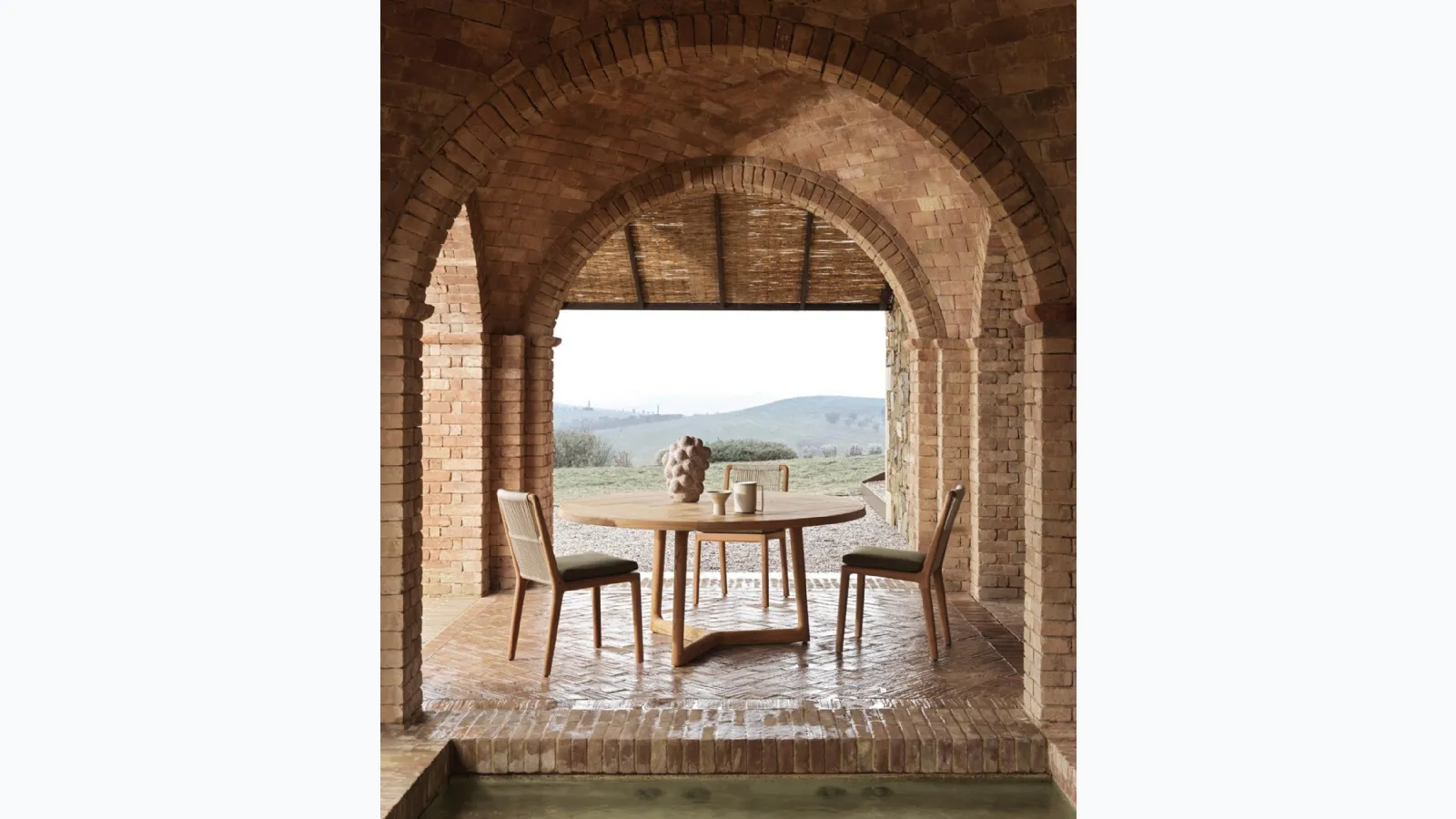 Cobea chair in solid teak wood with polyethylene weaving by Molteni & C.