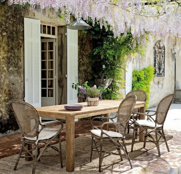 Edelina chair in rattan with armrests by Bizzotto.