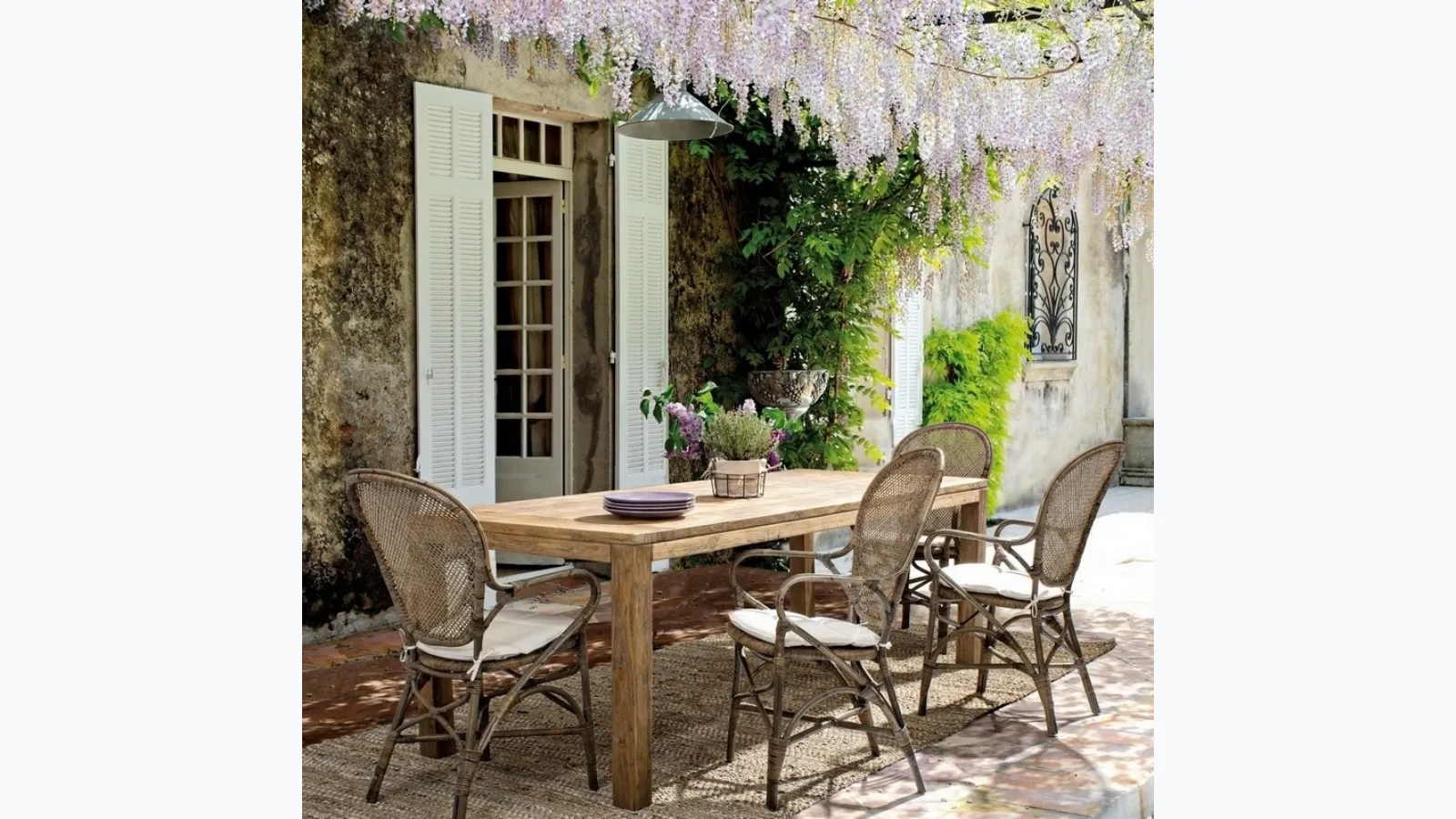 Edelina chair in rattan with armrests by Bizzotto.