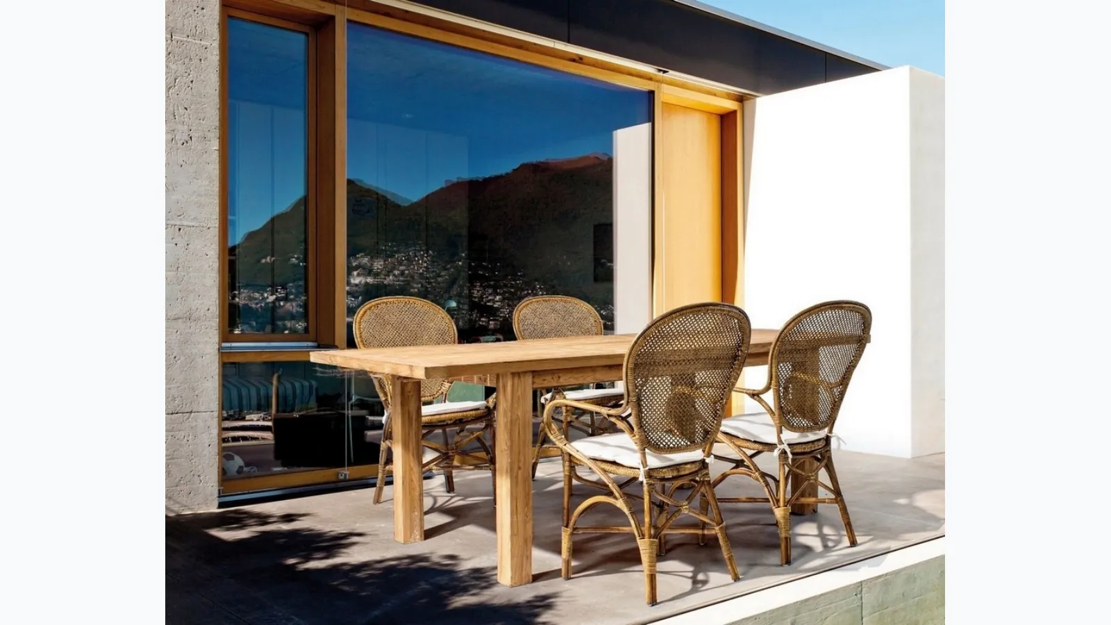 Edelina rattan chair with armrests by Bizzotto.