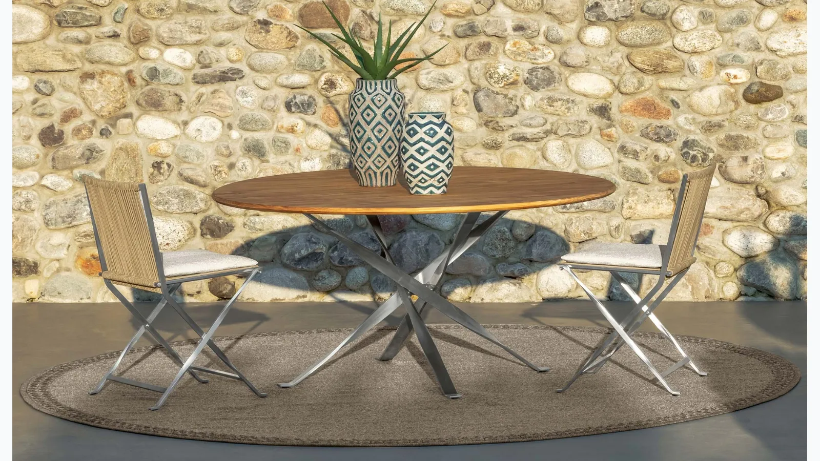 Round wooden and metal table with fabric and metal George chairs by Talenti.