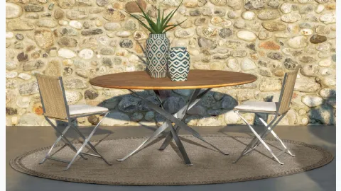 Round wooden and metal table with fabric and metal George chairs by Talenti.