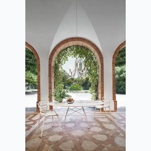 Glossy table in ceramic and steel by Kartell.