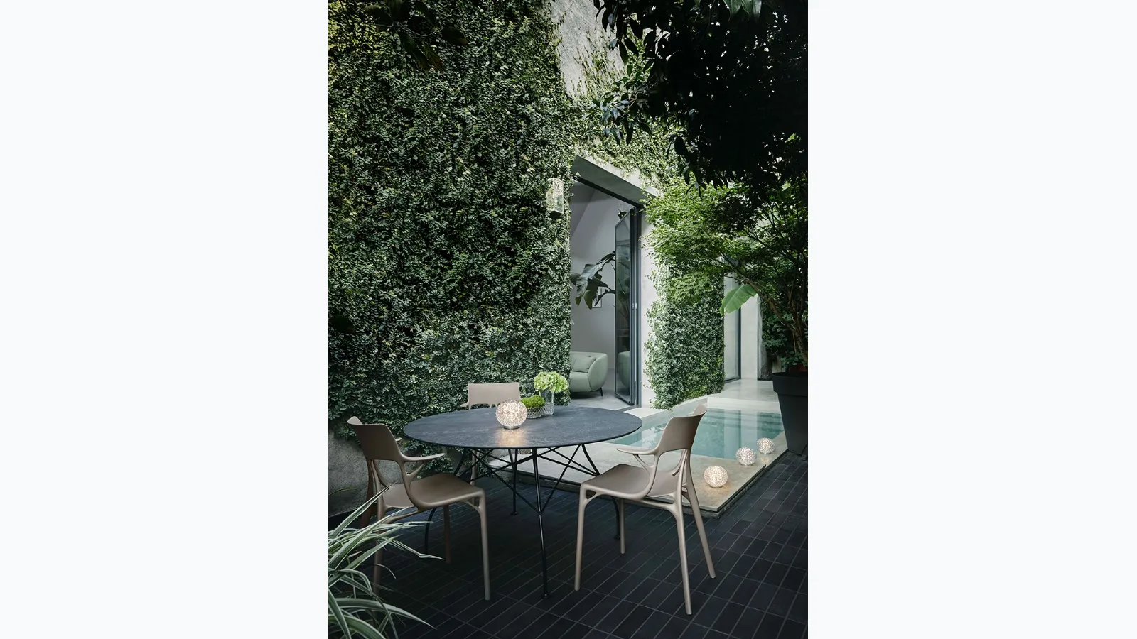 Glossy table in stoneware and steel by Kartell