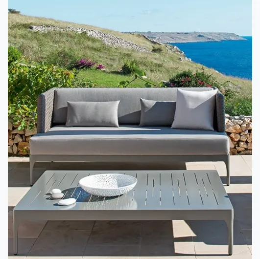 Infinity sofa in Lightwick fiber and aluminum coffee table by Ethimo.