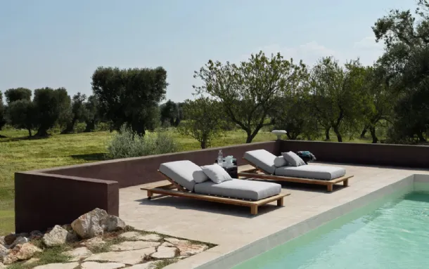 Teak sun lounger Inout by Gervasoni.