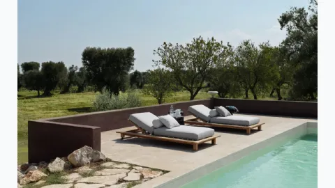 Teak sun lounger Inout by Gervasoni.