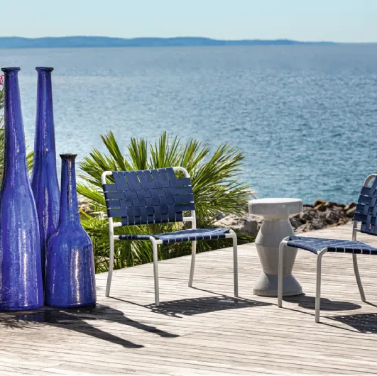 Inout armchair in aluminum with elastic strap by Gervasoni.