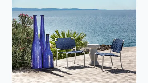 Inout armchair in aluminum with elastic strap by Gervasoni.