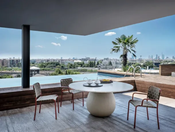 Inout chair in elastic straps and aluminum by Gervasoni.