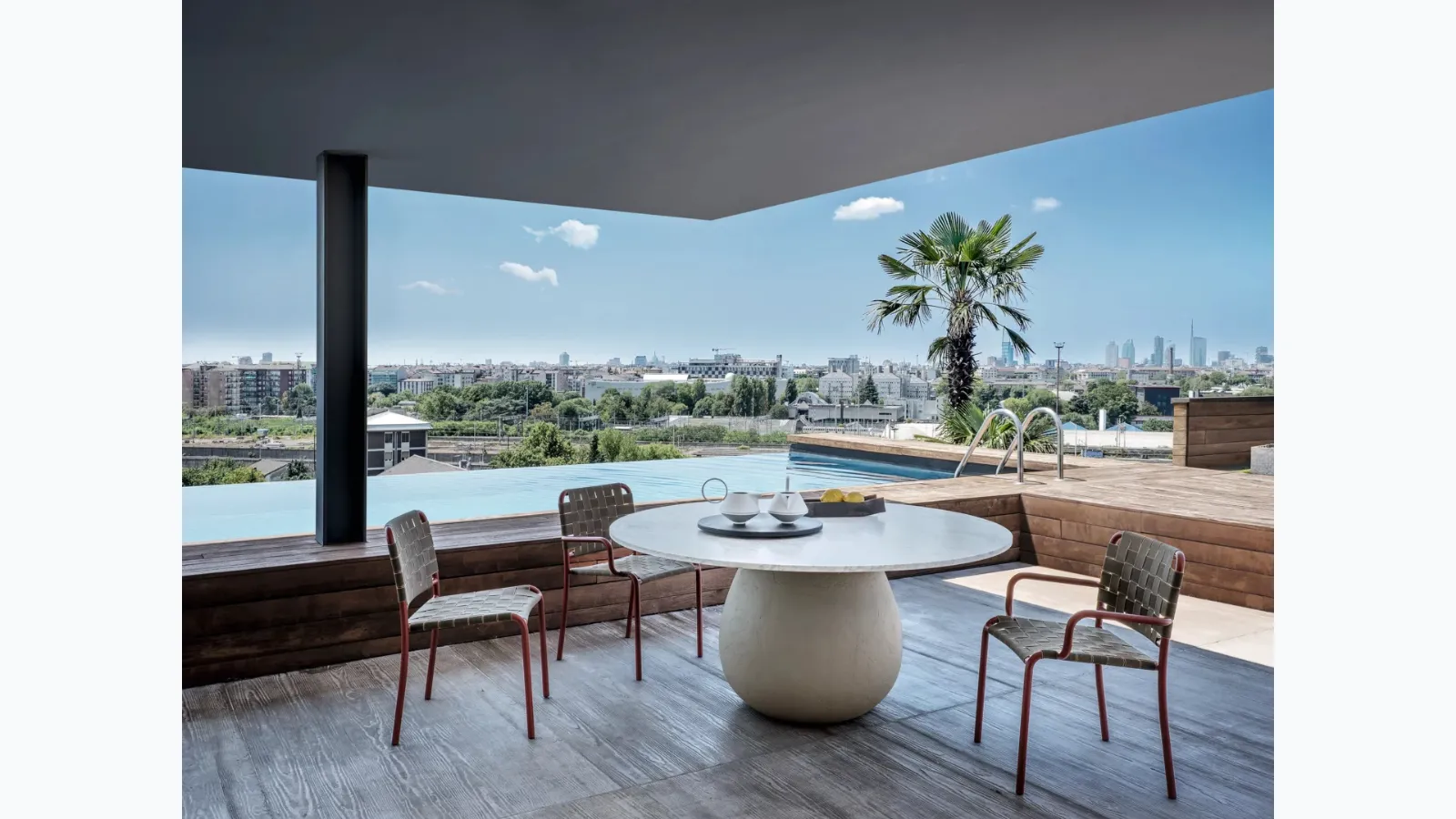 Inout chair in elastic straps and aluminum by Gervasoni.