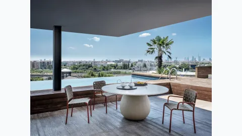 Inout chair in elastic straps and aluminum by Gervasoni.