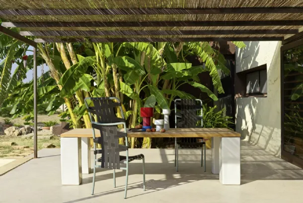 Inout table in teak and concrete by Gervasoni.
