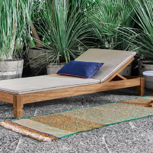 Jeko sun lounger in wood with Gervasoni fabric cushion.