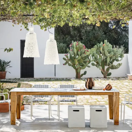 Jeko table in marble and reclaimed teak by Gervasoni.