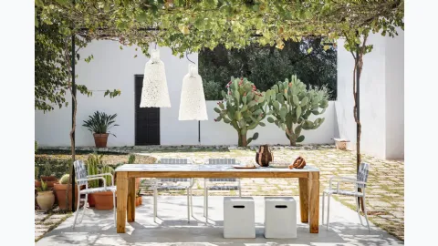 Jeko table in marble and reclaimed teak by Gervasoni.