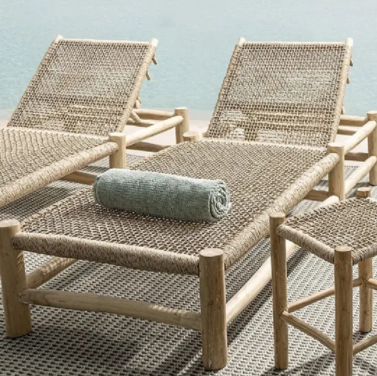 Sunbed and stool in synthetic fiber and Lampok wood by Bizzotto.