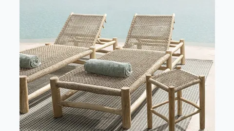 Sunbed and stool in synthetic fiber and Lampok wood by Bizzotto.