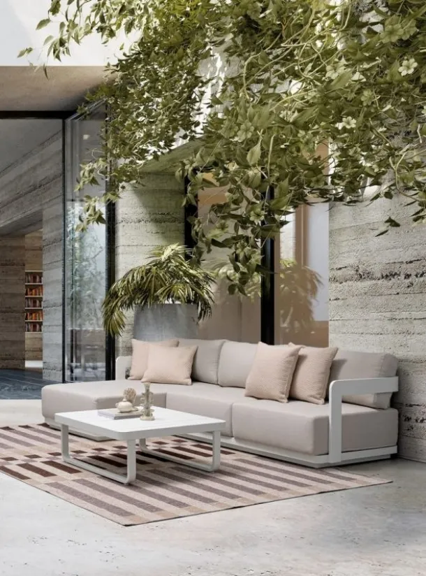 Sofa with peninsula and Mariel coffee table by Bizzotto.