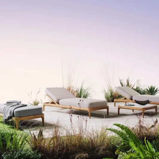 Sun lounger and Mediterranean wooden pouf with Gervasoni padded cushions.