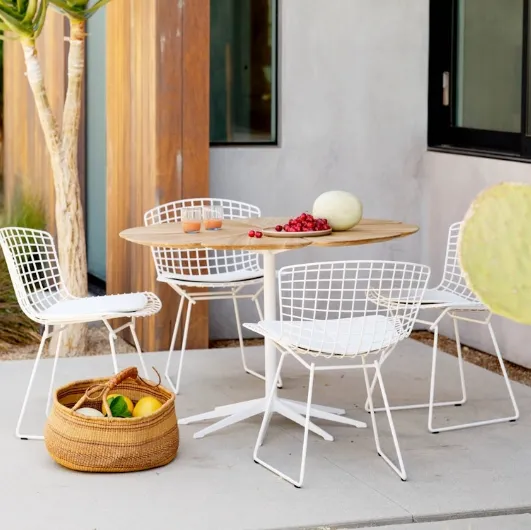 Petal® Dining Table in teak by Knoll